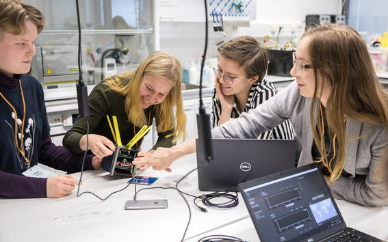 Girls building satellite 